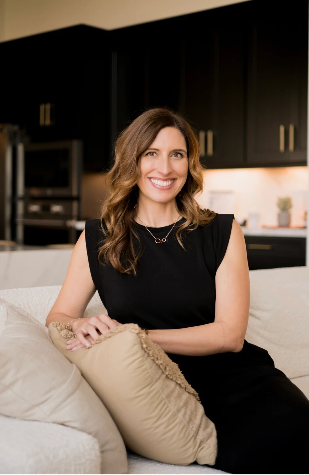 Carrie Groce seated in a welcoming living space
